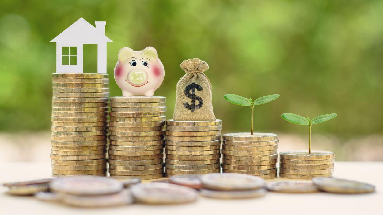 several coins scattered in front of five unequal stacks of coin with symbols on each representing the goal for the stack and representing the assets to be considered in superannuation and estate planning beneficiary nominations