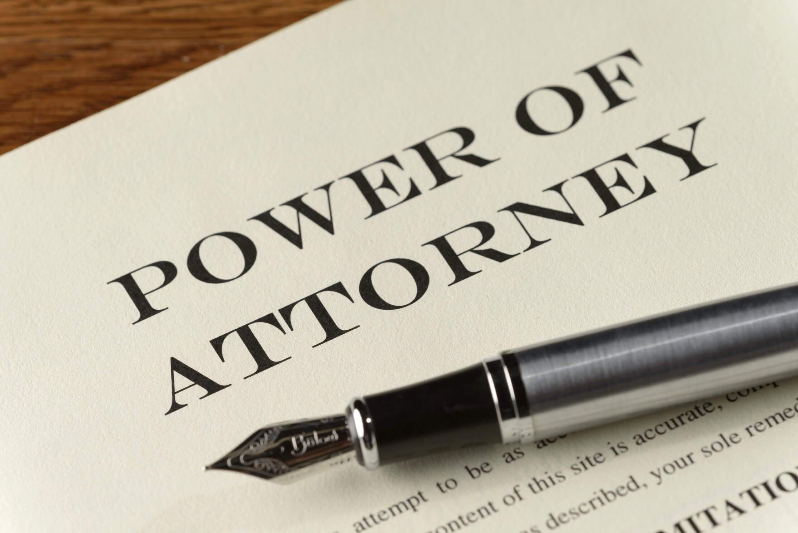 Title Page of a Power of Attorney document ready to be signed with a fountain pen lying in wait