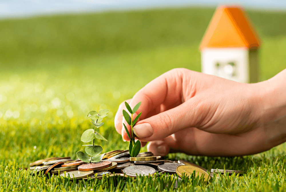 composite image of a hand tending a new plant growing from a mound of coins surrounded by green grass and with a modect home in the background, reflecting the importance of superannuation in your 20s and 30s