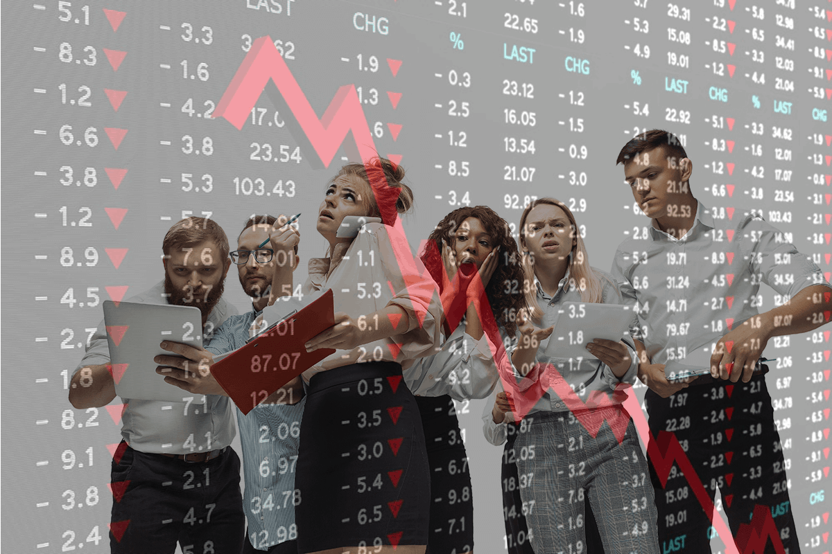 image of a group of anxious investors reviewing their portfolios; an image of a board of share prices is overlaid, with a volatile downsloping trend line indicating the cause of their panic - their strategy should allow investors to ignore volatility