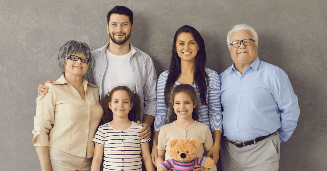 Family portrait of three generations signifying the importance of the financial support of a life insurance strategy - and honouring the daughter's experience with cancer and finding trauma insurance beneficial; showing the need for wealth management preparation of future generations
