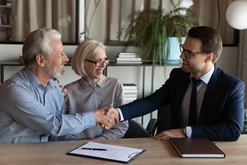 older couple taking advice from their financial advisor in his office on the commencement of term allocated pensions