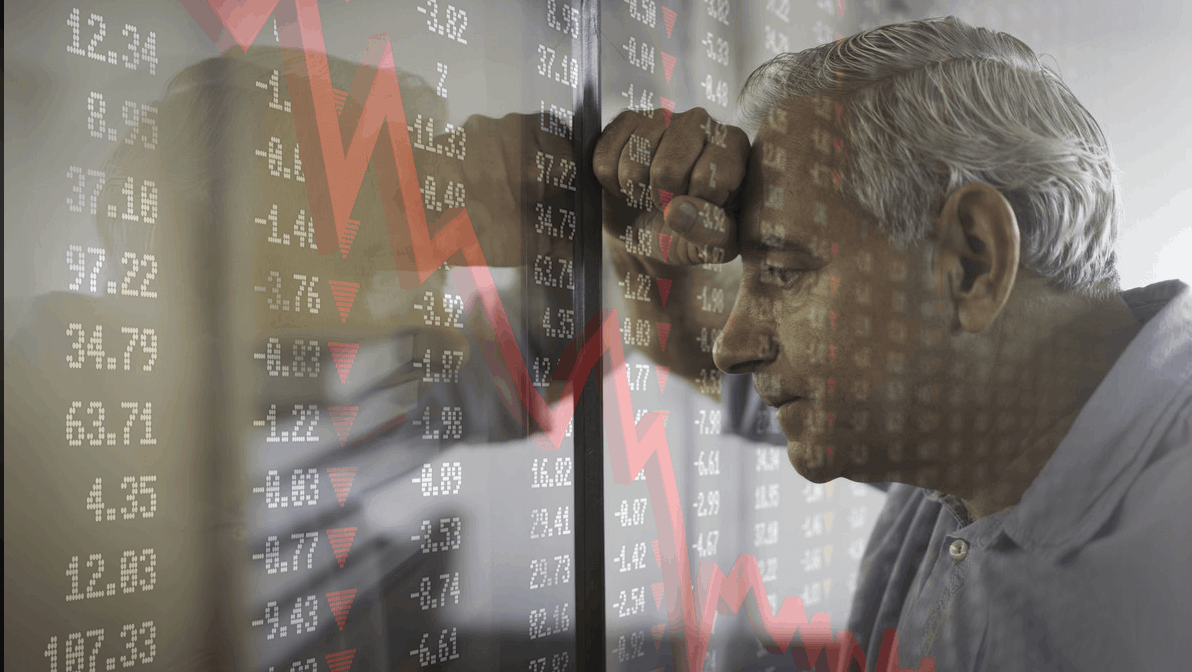 investor pondering investment market prices falling and wishing for a floor to be put under further risk as thge imposed graph shows a downward trend - in responce to which he is cautioned about investment risk regulation impacts